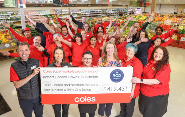 Coles Team Members, Liz accepting cheque